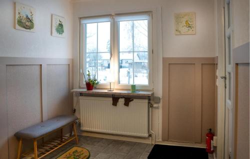 a room with a window and a bench in front of it at 2 Bedroom Lovely Home In Mörlunda in Mörlunda