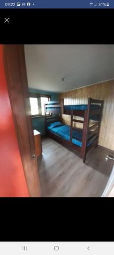 En eller flere senger på et rom på Cabaña con tinaja Tenten vilu