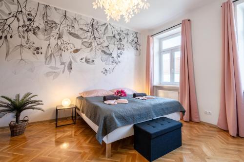 a bedroom with a bed and a large window at revLIVING Apartments Eggenburg in Eggenburg