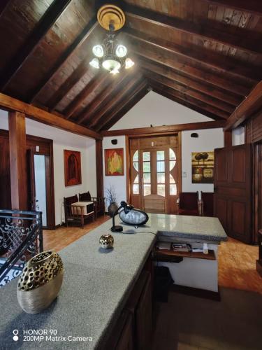 a kitchen with a large counter top in a room at Парк - Хотел Макензен in Melnik