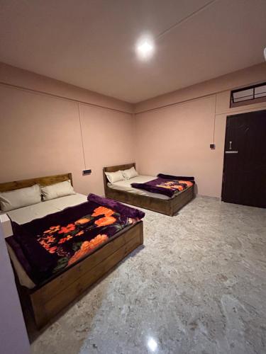 Katil atau katil-katil dalam bilik di Querencia Homestay