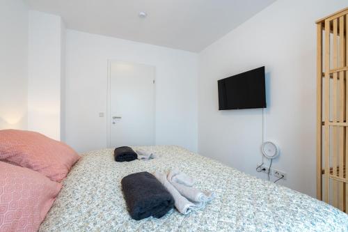 Ένα ή περισσότερα κρεβάτια σε δωμάτιο στο revLIVING premium THE LODGE Großmeiseldorf Ziersdorf