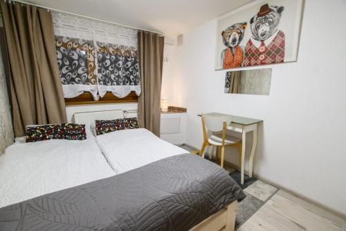 Posteľ alebo postele v izbe v ubytovaní APARTAMENT TAJEMNICZY OGRÓD ŚCISŁE CENTRUM ZAKOPANE