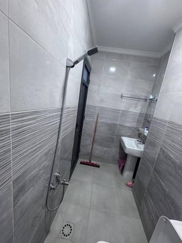a bathroom with a shower and a sink at Apartment in Houceima, Ajdir in Ajdir