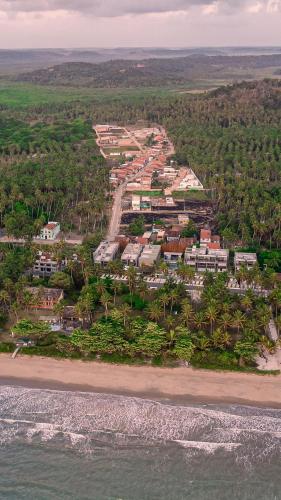 an aerial view of a resort on the beach at Flats Japaratinga - a 200m da praia com varanda in Japaratinga