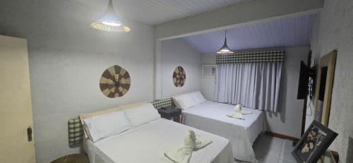 Ένα ή περισσότερα κρεβάτια σε δωμάτιο στο Casa Praia Completa Barra Grande Com Piscina