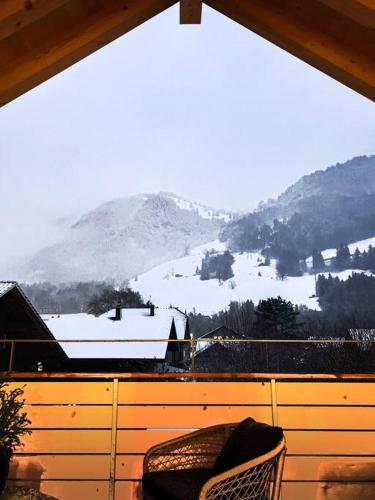 a view of a snow covered mountain from a window at Hidden Retreats The Niesen in Reichenbach
