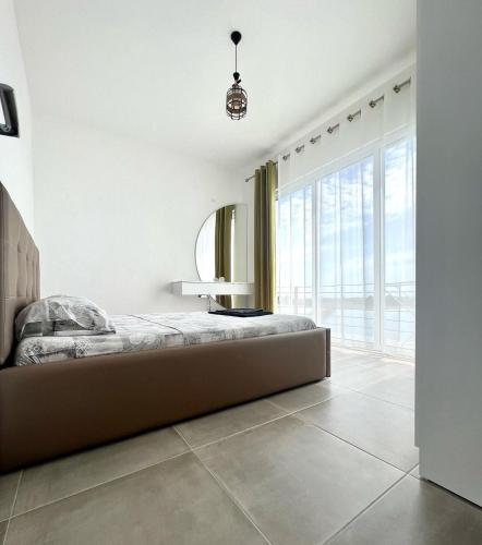 Llit o llits en una habitació de Sunset Apartments