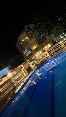 an overhead view of a swimming pool at night at HOTEl LA CANDELARIA ROOM HOUSE in Mangue
