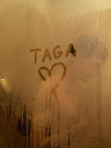 a heart painted on a window with the word tacerror at Taga Suites in Catania