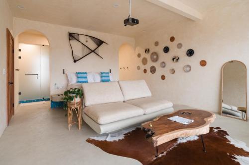 a living room with a couch and a table at Native Residence in Rosarito