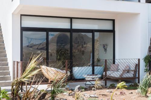 a room with a view of the mountain through a window at Native Residence in Rosarito
