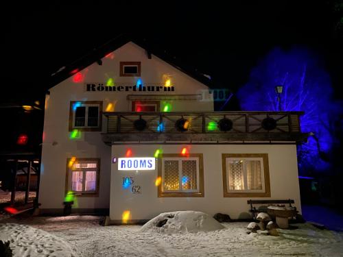 a house with christmas lights on it at night at Ferienhaus-Römerthurm in Schöder