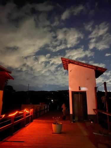 a building on a roof with lights on it at Villa Macacos in Nova Lima