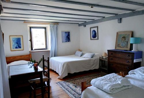 Katil atau katil-katil dalam bilik di Maison le Presbytère