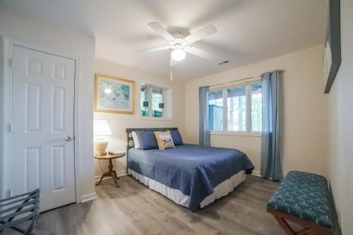 a bedroom with a bed and a ceiling fan at Cedar Hall in Bumpass