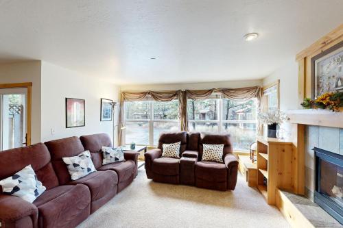 a living room with a couch and two chairs and a fireplace at Pacific Shorepine in Pacific City