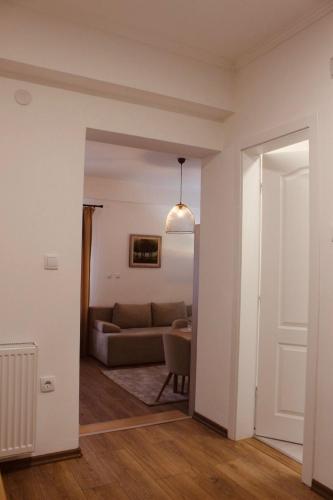 a living room with a couch and a table at Apartmani Grot Pale in Pale