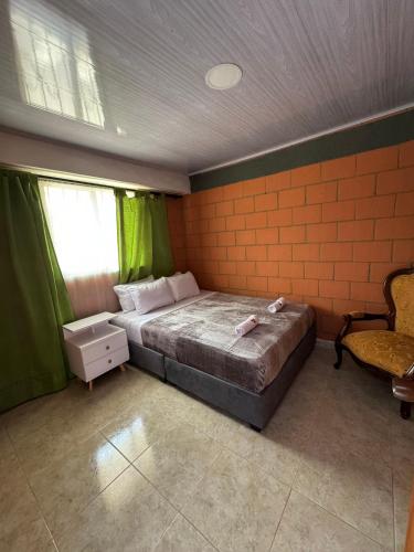 Katil atau katil-katil dalam bilik di Casa Familiar de la villa