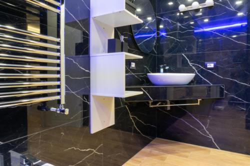 a bathroom with a sink and a mirror at HOLIDAYS HOMES ROME GOLF Appartamenti Marco Simone AeB in Marco Simone