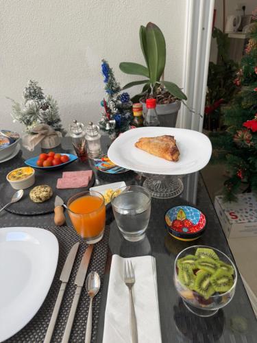 a table topped with food and vegetables on a table at Escape to St Julians in St Julian's