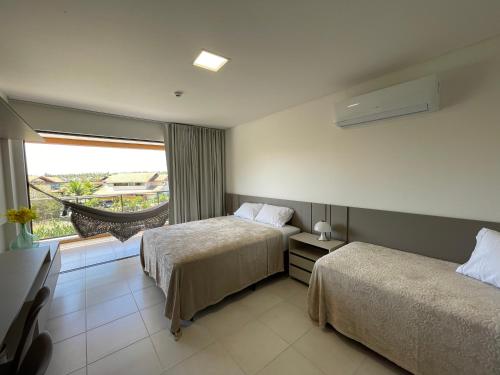 Postel nebo postele na pokoji v ubytování Flats Eco Resort Praia dos Carneiros