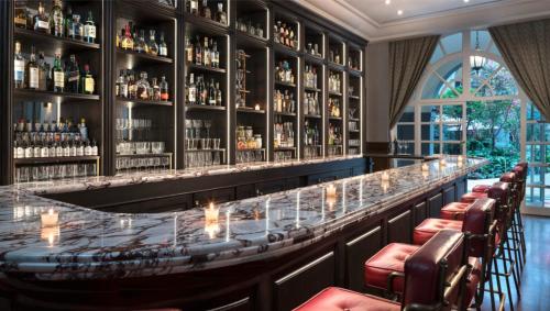 a bar with lots of bottles of alcohol at Four Seasons Hotel Mexico City in Mexico City