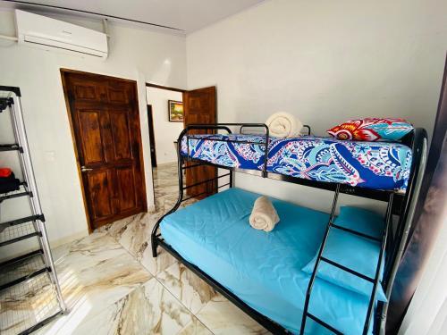 a bedroom with two bunk beds in a room at Blue Rriver House in Samen