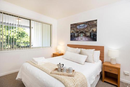 Ένα ή περισσότερα κρεβάτια σε δωμάτιο στο The Marina Unit 310