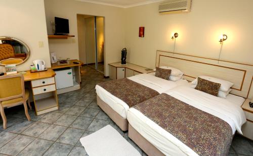 Katil atau katil-katil dalam bilik di Minen Hotel