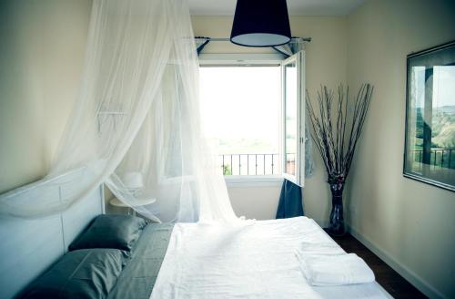 En eller flere senge i et værelse på Tenuta Santini