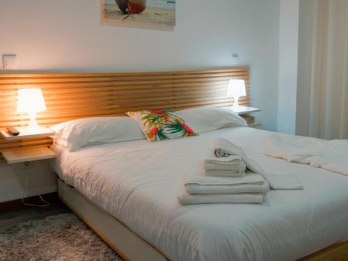 Giường trong phòng chung tại Casa de Férias Quintinha de Mirão