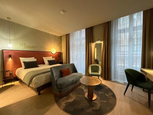 Postel nebo postele na pokoji v ubytování Hôtel Mercure Montauban