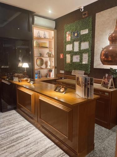 a kitchen with a wooden counter top in a room at Hotel Lusitano in Vilar Formoso