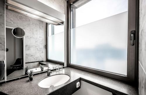 Koupelna v ubytování Hotel Mirage Düsseldorf-Neuss
