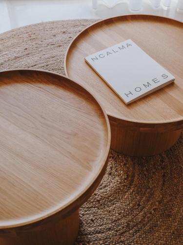 a wooden table with a sign that says new home at Aguas de Ibiza Grand Luxe Hotel - Small Luxury Hotel of the World in Santa Eularia des Riu