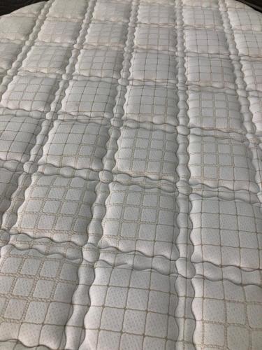 a close up of a white mattress with patterns at Palladium Apart Service in São Vicente