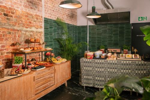 a bakery with a buffet of food on display at Lulu Guldsmeden in Berlin