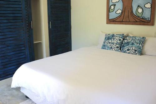 Ένα ή περισσότερα κρεβάτια σε δωμάτιο στο Sleepy Gypsea Villa Siargao