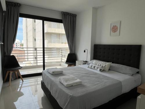 Ένα ή περισσότερα κρεβάτια σε δωμάτιο στο Departamento 42 - Mural Home
