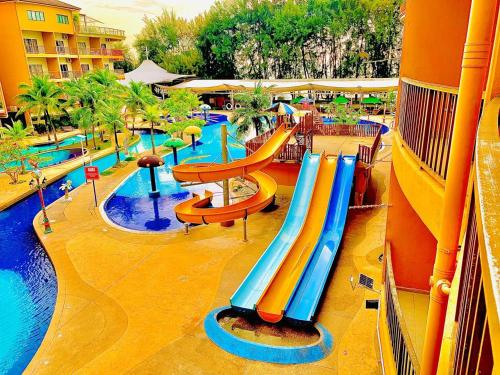a water park with a slide and a pool at Gold Coast Morib Theme Park View Unit in Banting
