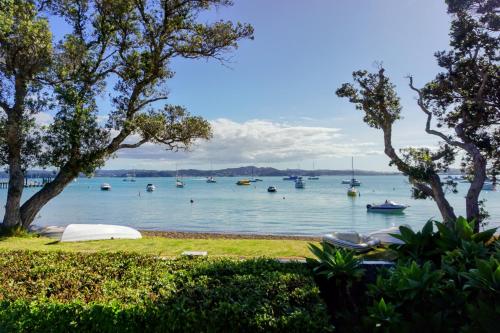 a view of a body of water with boats in it at LAST ON THE STRAND, RUSSELL - The BOATHOUSE in Russell