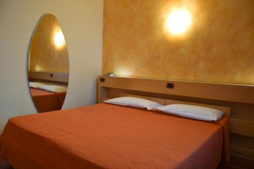 Un ou plusieurs lits dans un hébergement de l'établissement Hotel Losanna