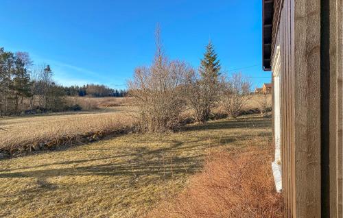 a view of a field from a house at 4 Bedroom Awesome Home In Fosslandsosen in Fosslandsosen