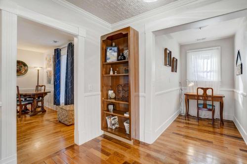 a living room with a book shelf and a table at 1BR Quiet Neighborhood & Nearby Parks in Manitou Springs