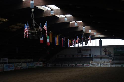 a row of american flags hanging from a building at Cowboys Guest Ranch in Voghera