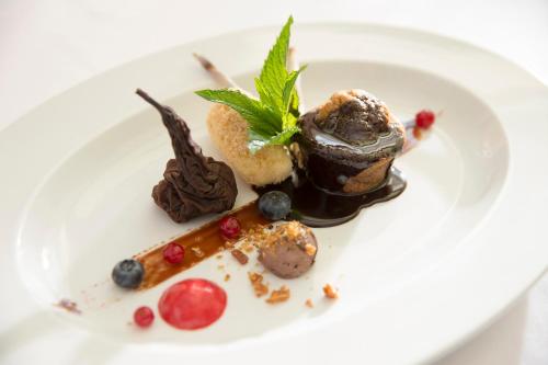 a plate of food with desserts on a white plate at Hotel Muhr in Pöllauberg