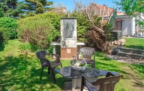 a patio with a table and chairs in a yard at Ferienhaus Dabel in Dabel