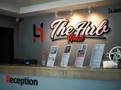 a sign for theitz hotel on a counter in a restaurant at The Hub Hotel Surin in Surin