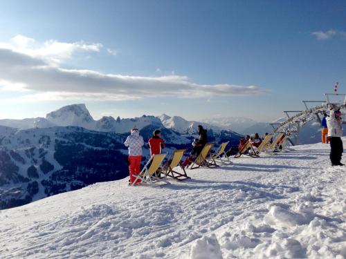 a group of people standing on top of a snow covered mountain at Apartment Bergjuwel in Sonnenalpe Nassfeld